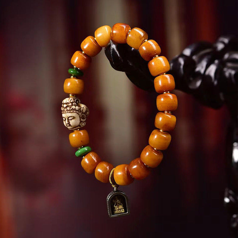 Pulsera tibetana de cuentas de hueso de yak en forma de barril con accesorio Guanyin: símbolo de compasión y bendición espiritual.