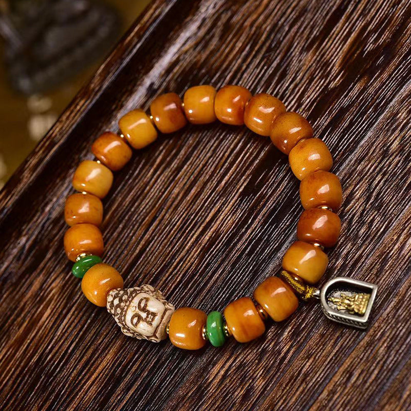 Pulsera tibetana de cuentas de hueso de yak en forma de barril con accesorio Guanyin: símbolo de compasión y bendición espiritual.