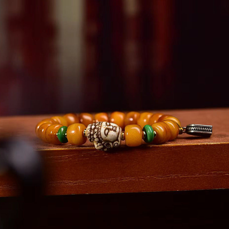 Pulsera tibetana de cuentas de hueso de yak en forma de barril con accesorio Guanyin: símbolo de compasión y bendición espiritual.